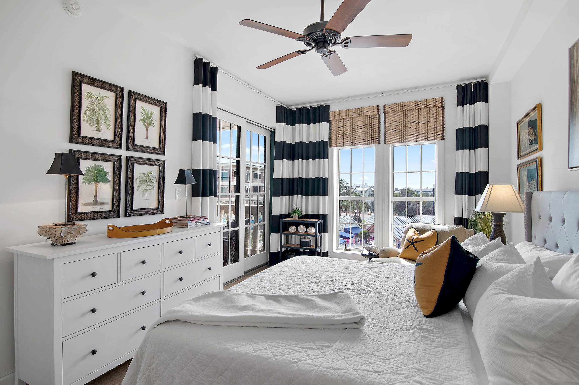 Primary bedroom with view of gulf, opens to balcony overlooking amphitheater, designer furnishings